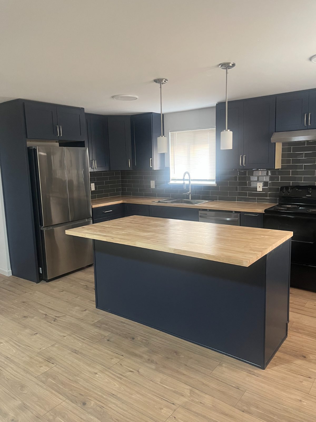 Navy kitchen with butcher-block island