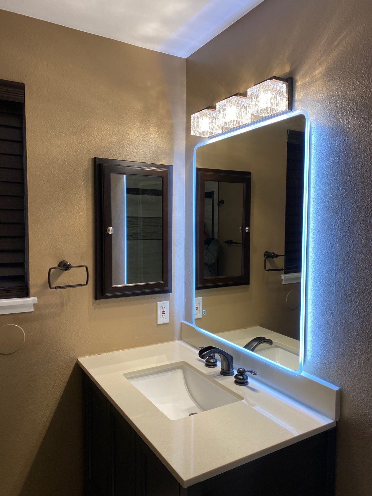 Bathroom vanity with quartz top and backlit LED mirror